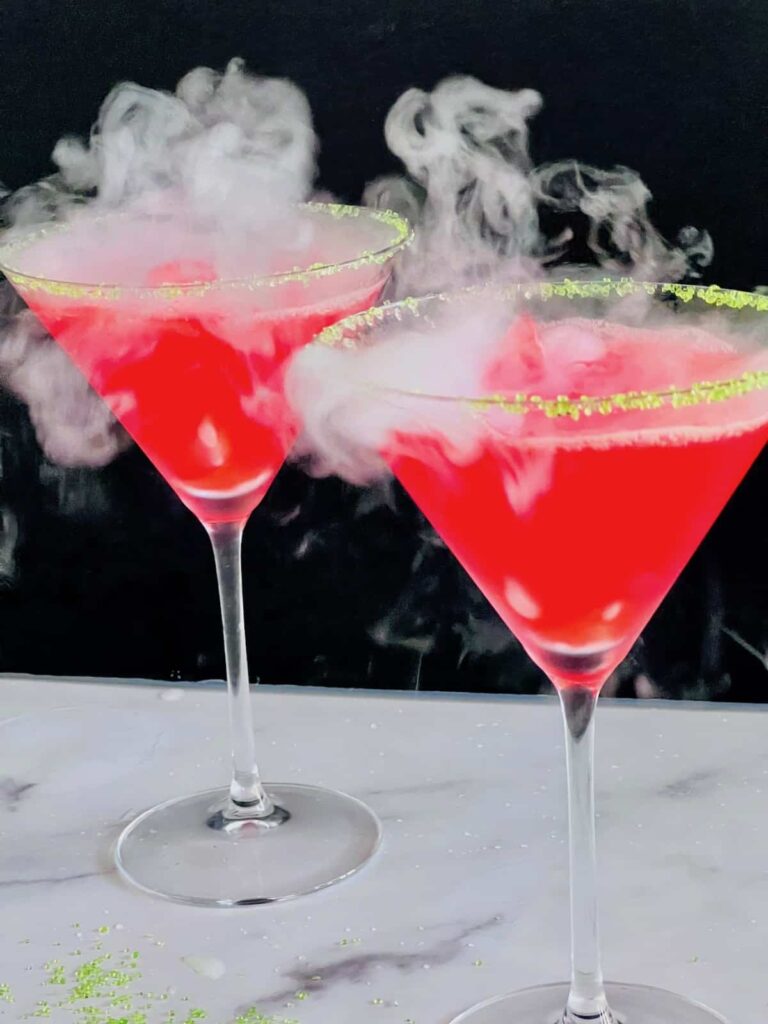 Hocus Pocus Cocktails with steam rolling off the glasses.