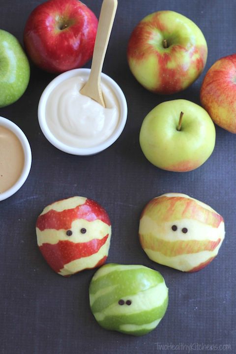 Apples with peels sliced to look like mummies.