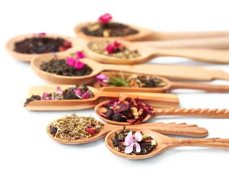 Various loose-leaf teas in spoons
