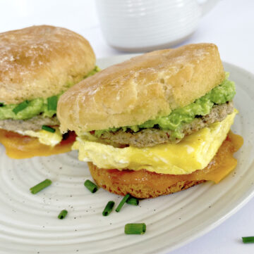 Gluten free breakfast sandwiches on a plate with tea.