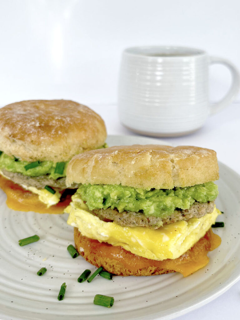Gluten free breakfast sandwiches on a plate with tea.