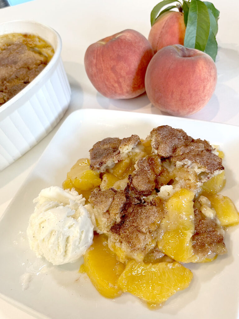 Easy Gluten Free Peach Cobbler with ice cream and fresh peaches