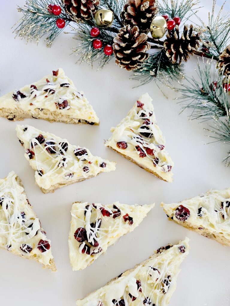 Gluten Free Cranberry Bliss Bars with Sparkly Holiday Decorations Around It