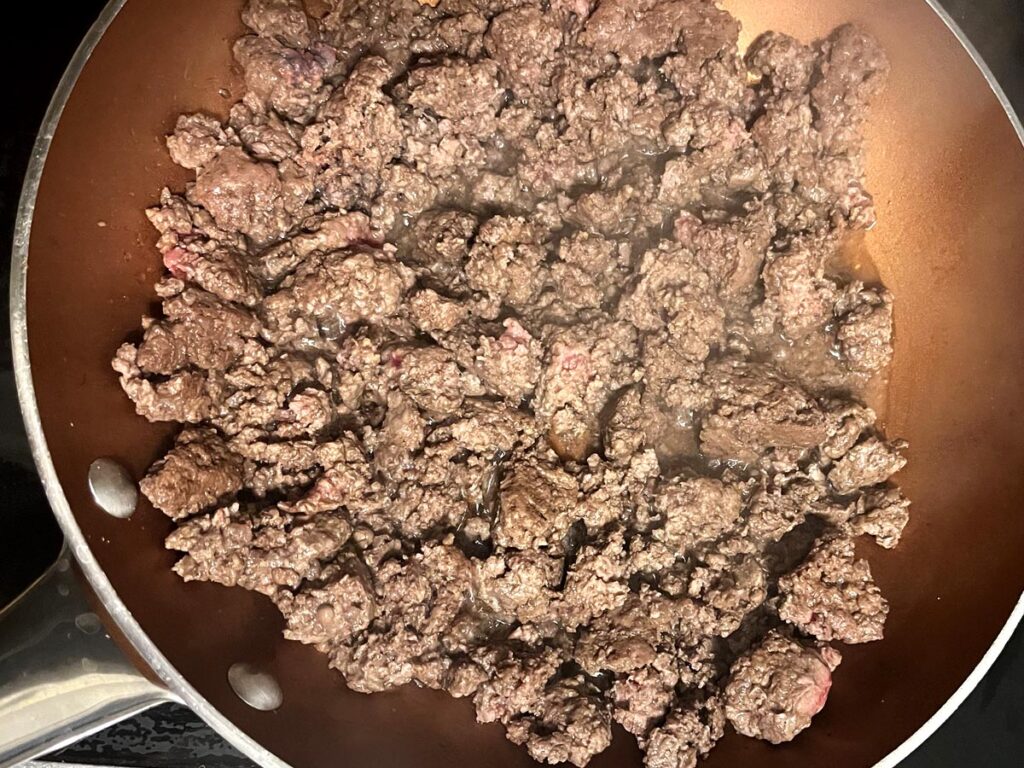 Frying ground beef in pan