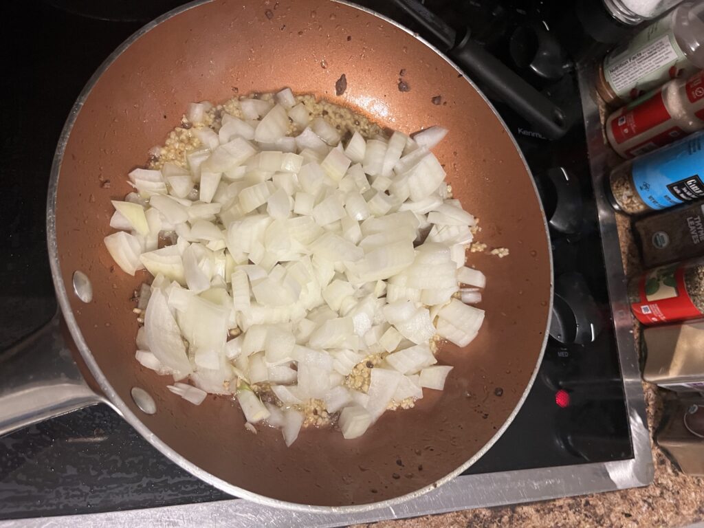 Sautéing diced onions and minced garlic