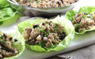 Chicken Lettuce Wraps with filling in bowl behind them