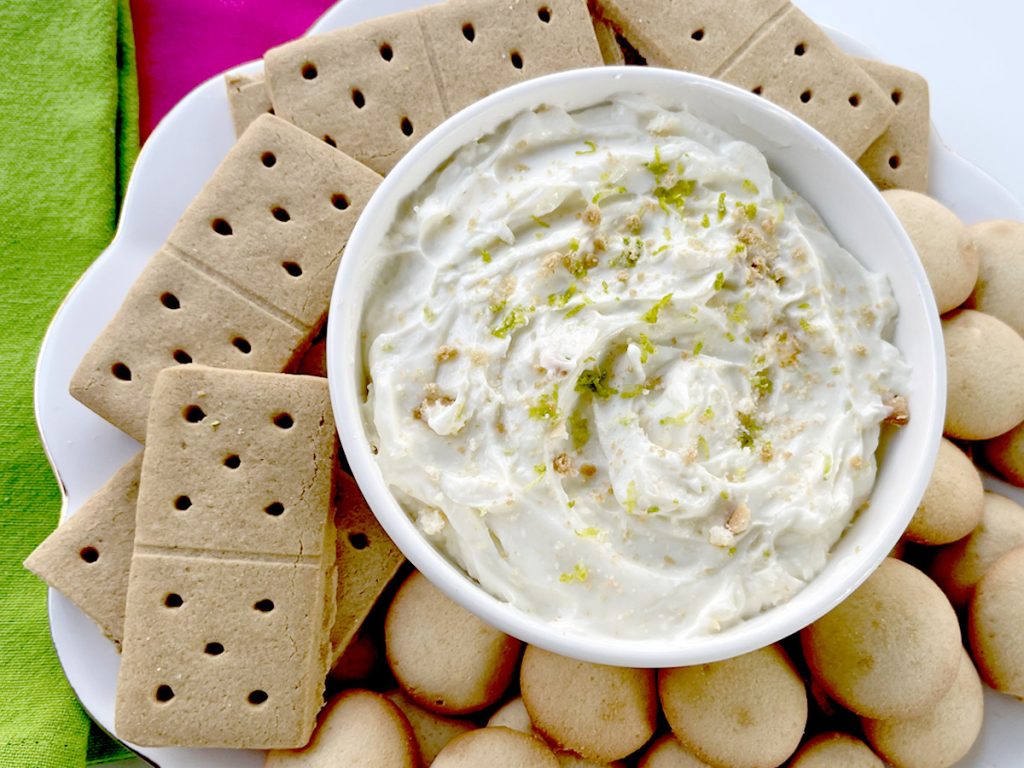 Key Lime Pie Dip Served with Cookies, Graham Crackers, and Bright Green and Pink Napkins